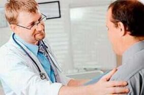 A man with prostatitis on an appointment with the doctor